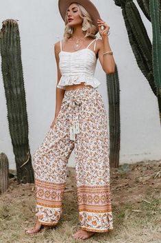 bohemian hippie flowing pants with palazzo fit bye bye to the skinny jeans and hello to these nice hippie bohemian pants! we love its soft and light fabric which is very pleasant to wear in summer. the high waist is equipped with a ribbon and tassels to tie on the front. its wide and flared fit, known as palazzo, adds allure to the silhouette while sublimating it. pants details fabric: viscose fit: palazzo length : ankles pattern:floral details: stretchy waist, tie front fabric with tassels seas High Waisted Flowy Pants, Ladies Outfits, Styl Boho, Pantalon Large