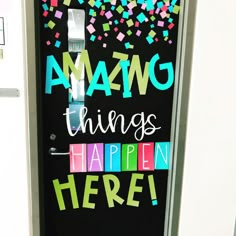 a door with the words amazing things happen here written on it and colorful confetti sprinkles