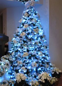 a blue and white christmas tree with lights