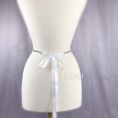 LISALI Skinny Wedding Dress Bridal Sash, Crystal Bridal Sash, Rhinestone Sash, Bridesmaid Belt, Wedding Dress Sash，Flower Belt This beatiful bridal sash is perfect for adding some bling to your dress! Made of - This beautiful sash is made with sparkly rhinestones details, very elegant. - The rhinestone portion is 16-34 inches long and about 0.4 inches wide. - satin ribbon - your color choice - the ribbon on the sash is a total of 100 inches long and it will fit sizes xs-xl. If you would like it White Bridal Belt For Bride, White Bridal Belt With Ribbon For Wedding, Satin Bridal Belt With Ribbon For Wedding, White Crystal Embellished Bridal Sash, White Satin Wedding Sash, White Satin Sashes For Wedding, Fitted Bridal Belt With Ribbon For Wedding, White Rhinestone Sashes For Bridesmaids, White Bridal Belt With Sashes For Bridesmaid