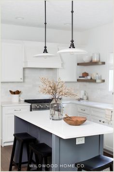 A kitchen island with seating not only adds extra dining options but also maximizes space. In this remodel, we had smaller custom cabinets built to gain extra inches while keeping full-depth end panels. This created the perfect spot for stools to tuck in, enhancing both style and function. Explore how our design blends practicality and aesthetic in this kitchen remodel for a space that's both inviting and efficient! Visit Wildwood Home Co at wildwoodhomecompany.com. Kitchen Vibes, Two Tone Kitchen, Island With Seating