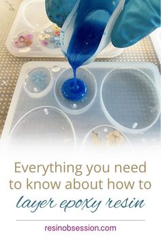 someone is pouring blue liquid into an ice cream container with the words, everything you need to know about how to layer party resin