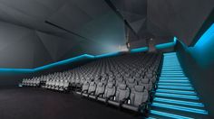 an empty auditorium with white chairs and blue lighting