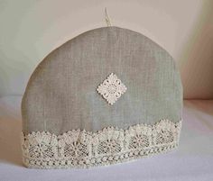 an old fashioned hat with lace on it