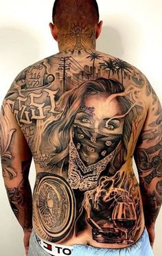 a man with many tattoos on his back