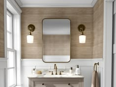 a bathroom with two sinks and a large mirror