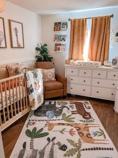 a baby's room with an animal themed rug and crib in the corner