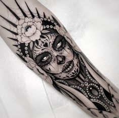 a black and white tattoo with a woman's face