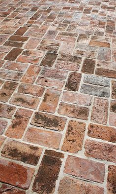 an image of a brick floor that looks like it has been cleaned and stained off