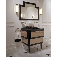 a bathroom with a sink, mirror and towel rack on the wall next to it