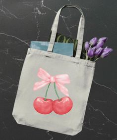 This cherry coquette tote bag is perfect for those who appreciate fruit-themed aesthetic designs. It's ideal for carrying books and everyday essentials, adding a touch of whimsy to your outfit. Perfect for fruit lovers or those who appreciate a unique design. Great for everyday use, picnics, trips to the farmer's market, or as a gift for a friend who loves cherries. Product features - 100% Cotton canvas for durability - Flat corners for a sleek look - Reinforced stitching on carrying handles - 12 oz heavy fabric for sturdiness - Available in natural and black colors Care instructions - Do not iron directly over the printed area - print may stick to the iron. - Spot clean - Do not bleach - Line dry Cute Canvas Bag For Back To School, Trendy Bags For Back To School Gifts, Casual Canvas Bag For Back To School, Trendy Pink Canvas Bag As Gift, Trendy Pink Canvas Bag For Gift, Coquette Tote Bag, Tote Shoulder Bag With Bow For Shopping, Cherry Tote Bag, Strawberry Print Tote Bag For Daily Use