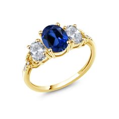 three stone ring in yellow gold with blue and white stones