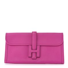 This is an authentic HERMES Swift Jige Elan 29 Clutch in Magnolia. This elegant neutral clutch bag is crafted of luxurious swift calfskin leather in bright pink. There is a cross over flap and a strap that tucks under a leather Hermes "H." Luxury Pink Leather Clutch, Luxury Pink Clutch For Travel, Luxury Pink Clutch, Pink Leather Clutch With Detachable Strap, Pink Formal Bag With Fold Over Clasp, Formal Pink Bag With Fold Over Clasp, Luxury Pink Clutch For Formal Occasions, Luxury Pink Clutch With Detachable Strap, Designer Pink Clutch For Evening