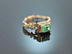 Rare historical Neo-Renaissance ring from the 19th century, with emerald and decorative enamel, made of 585 / 14 kt gold (tested and guaranteed). The noble, green colored stone of approx. 0.6 carats is cut in an octagonal cut and sits in a raised, finely designed bezel setting, which is laterally A floral ring band with tendrils and flower shapes completes the historical design. The flower motifs on the ring band are also accentuated with decorative enamel. The entire design of the ring - typica Ring With Emerald, Flower Shapes, Flower Motifs, Historical Design, Floral Ring, Colored Stone, Ring Shapes, Ring Band, Flower Shape