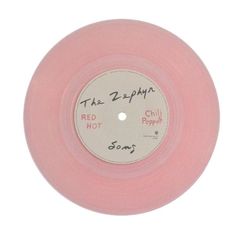 a pink record with the words red hot chili peppers written on it's side