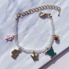 Mischievous Friends Beads Bracelet Introducing a delightful bracelet adorned with adorable character charms that celebrate the joy of friendship. This bracelet features a mischievous rabbit charm and a cheerful rabbit charm, symbolizing the playful bond between friends. Crafted with clear white beads that catch the sunlight and shimmer beautifully, this bracelet adds a touch of enchantment to your style. Wear this bracelet as a reminder of the special connections we share with our loved ones and Rabbit Charm, Between Friends, Clear White, Beads Bracelet, White Beads, Ring Necklace, Beaded Bracelet, Bead Charms, Anklets