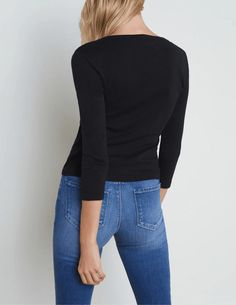 L'Agence Rowena Three Quarter Sleeve Henley Top in black. All Sale Merchandise is FINAL SALE. Three quarter sleeve. V-neckline. Henley silhouette. Slim fit. Half button front. Pull on style. Ribbed knit. 100% Cotton. About 21" From Shoulder to Hem. Sleeve Length: 17.5". Model Details: Height 5’10.5" | Bust 33" | Waist 24" | Hips 34" | Wearing Size XS. Made in Los Angeles. Elegant Black V-neck Long Sleeve Top, Black V-neck Long Sleeve Top For Fall, Elegant Stretch V-neck Cardigan, Elegant Black Long Sleeve V-neck Top, Black V-neck Top For Workwear In Fall, Black V-neck Top For Fall Workwear, Fitted Fine Knit V-neck Sweater, Black V-neck Knit Top For Fall, Fitted Cardigan With 3/4 Sleeves For Work