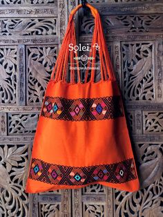 "This gorgeous embroidered Mexican Satchel or Morral is perfect to style with any outfit! The traditional Mexican embroidery is full of culture and colors. This Bag is embroidered on a waist loom. Dimensions: 15.5\" x 15.5\"" Folk Style Embroidered Multicolor Shoulder Bag, Folk Style Multicolor Embroidered Shoulder Bag, Traditional Orange Tote Bag, Traditional Orange Bag For Daily Use, Traditional Orange Shoulder Bag For Everyday Use, Traditional Orange Shoulder Bag For Travel, Traditional Orange Shoulder Bag For Everyday, Traditional Orange Rectangular Bag, Embroidered Orange Bags For Daily Use