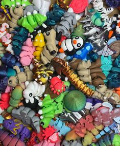 there are many different types of toys in this pile, and one is on the floor