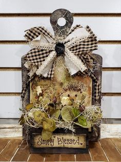 a wooden box with some plants inside of it and a sign that says simply released