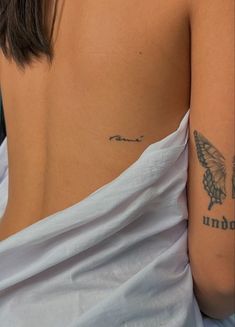 a woman with a tattoo on her arm