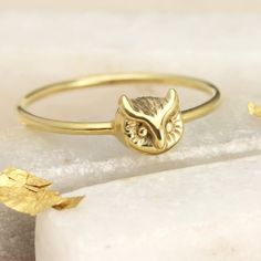 Twit twoo - look at yoooouu - our little feathery friend is not only charming but one of our best sellers!A tiny 6mm owl head, mounted on an equally tiny 1.2mm ring shank. Available in shiny sterling silver or gold plated silver. This little fella is perfect for stacking with other rings but it is just as stylish worn solo. It has some textured detail with polished high points. You can really spoil yourself or a loved one by making a set with our Owl Necklace. At Jana Reinhardt, we pride ourselv Silver Bird Ring, Owl Head, Bird Ring, Woodland Jewelry, Owl Ring, Bird Rings, Hoot Owl, Owl Gifts, Silver Owl