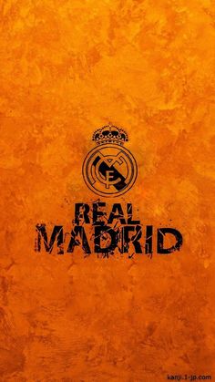 an orange wall with the words real madrid on it