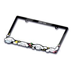 a black license plate frame with cartoon sheep on it's side and stars in the middle