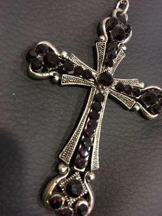 Silver plated with garnet crystals on an 18 inch chain. Love this pendant! Total must have! Makes a great gift as well. Rosary Style Necklace, Garnet Crystal, Black Cherry, Red Cross, Gorgeous Jewelry, Cherry Red, Ruby Red, Cross Pendant, Pendant Necklaces