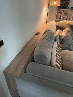 a couch sitting on top of a wooden table