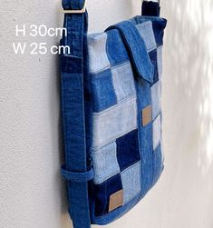 a blue purse hanging on the side of a wall