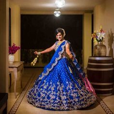 a woman in a blue and white bridal gown