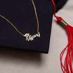 Graduation Necklace - Gift Necklace for Success Congratulate your special grad with our beautiful Graduation Gift Necklace. It's a lovely way to honor their hard work and success. Each necklace features their name in an elegant script, with a charming graduation cap topping the first letter. It's a stylish and personalized keepsake that they'll treasure for years to come. It's the perfect accessory for graduation day and beyond, serving as a reminder of their hard work and success. PRODUCT DETAI Elegant Gold Jewelry For Graduation, Adjustable Jewelry For Graduation Gifts, Personalized Jewelry For Graduation And Mother's Day, Elegant Silver Custom Text Name Necklace, Elegant Personalized Jewelry For Graduation Gift, Personalized Silver Necklace For Graduation, Cheap Personalized Necklaces For Graduation, Dainty Sterling Silver Name Necklace, Tarnish Resistant, Silver Tarnish-resistant Name Necklace As Gift