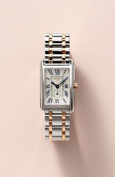 Launched in 1997, the DolceVita collection expresses a contemporary interpretation of watchmaking elegance. The slim rectangular case, a silver flinqué dial, blue steel hands and painted Roman numerals create a refined, feminine aesthetic. Style Name:Longines Dolcevita Bracelet Watch, 20.5mm X 32mm. Style Number: 5462325. Available in stores. Roman Numeral Wrist Watch, Elegant Rectangular Watch Accessories With Date Display, Elegant Silver Watch With Square Face, White Gold Watch Accessories With Rectangular Metal Dial, Elegant Watches Women, Rectangle Watch, Gold And Silver Watch, Womens Designer Watches, Silver Watches Women