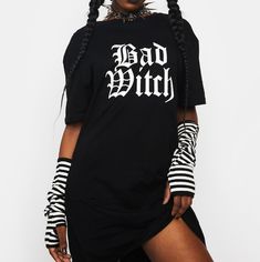 Dolls Kill Nwt!! "Bad Witch" Oversized T-Shirt / Dress - Size: Small - Color: Black With White Print - Fabric: 100% Cotton Approx Measurements: - Pit To Pit: 18.5in - Shoulder Seam To Seam: 18.5in - Length: 30.75in * Note: First And Last Images Are Stock Pics Used To Show Style/ Fit. All Other Pics Are Mine And Show The Actual Shirt For Sale. Black Short Sleeve Punk Dress, Black Punk Cotton Dress, Black Cotton Punk Dress, Edgy Short Sleeve Dress For Alternative Fashion, Black Short Sleeve Dress For Alternative Fashion, Gothic Cotton Dresses For Alternative Fashion, Casual Short Sleeve Halloween Dress, Cotton Streetwear Dress With Graphic Print, Black Graphic Print Dress For Streetwear