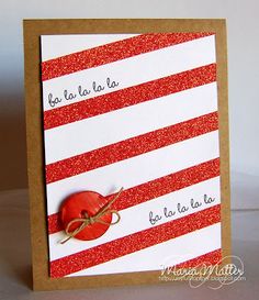 a red and white striped card with an orange button on it's side that says la la la