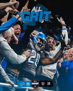 a group of people holding up their hands in the air while wearing blue and white uniforms