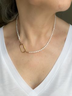 Add a touch of elegance to your everyday look with this stunning Tiny Rice Pearl Beaded Carabiner Necklace. This choker charm features delicate freshwater pearls meticulously strung together on a 14k gold filled chain. The unique stainless steel carabiner screw lock clasp adds a modern twist to this classic piece of jewelry. Perfect for elevating any outfit, this necklace is sure to become a staple in your collection. * Rice Pearl beads measure 2.5mm - 3.5mm (freshwater pearls) * June Birthstone Elegant Gold Necklaces With Carabiner Clasp, Elegant Necklaces With Carabiner Clasp For Gift, Elegant Jewelry With Carabiner Clasp, Beaded Carabiner, Charm Holder Necklace, Charm Holder, Pearl Charms, Pearl Gemstone, Necklace Sizes