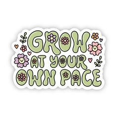 a sticker with the words grow at your own pace in green and pink flowers