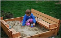 a young child playing in a sandbox