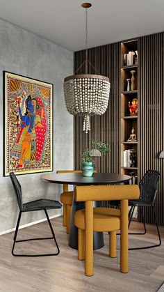 a dining room table with two chairs and a painting on the wall