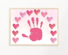 a pink handprint with hearts in the background