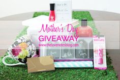 the mother's day giveaway is on display in front of an open box