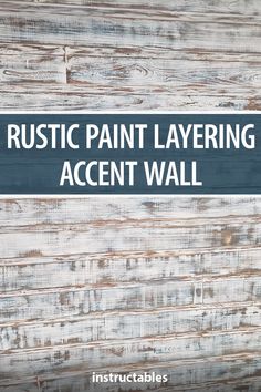 the words rustic paint layering accent wall are in white and blue on wood planks