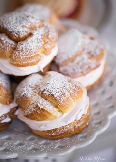 small pastries are piled on top of each other with powdered sugar toppings