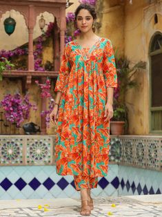 This is beautiful 2-piece set. The set comes with floral print kurta has V-neck, 3/4th sleeves and calf length teamed with printed trouser pant. 2-piece set Color-Orange Work - Floral Print Detailing Kurta Fabric-Cotton Kurta Length - 46 inch Sleeves- 3/4th Sleeves Sleeves Length - 17inches Neck-V Neck Bottom Fabric - Cotton Bottom Length - 38 inch Care-Dry Clean or Hand wash DISCLAIMER - The color of the product may be differ due to screen settings of device. A misprint here and a color drop sl Spring Multicolor V-neck Kurta, Spring Orange Straight Kurta, Bohemian Orange Sets With Printed Motifs, Traditional Orange Floral Print Kurta, Spring Floral Print Kurta With 3/4 Sleeves, Floral Print 3/4 Sleeve Kurta For Spring, Casual V-neck Kurta With Floral Print, Orange Floral Print Sets For Spring, Orange Floral Print Spring Sets