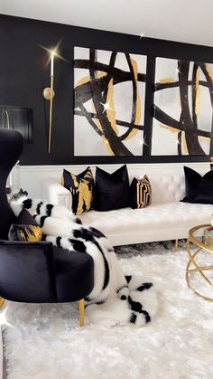 a black and white living room with gold accents