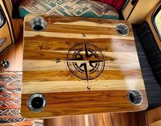 a wooden table with speakers on top of it