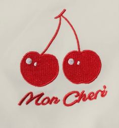 two cherries with the word man chef embroidered on them