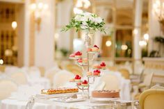 a table topped with lots of different types of cakes and desserts on top of it